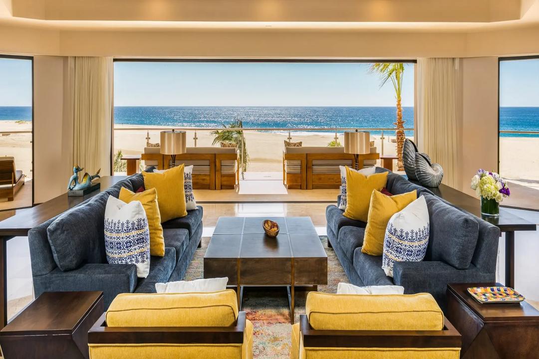 Luxurious oceanfront living room with panoramic ocean views and sophisticated coastal design
